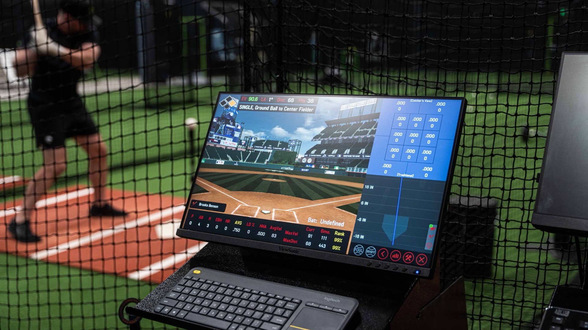 HitTrax screen at Endless Sports Complex showing real-time hitting data overlaid on a live training session
